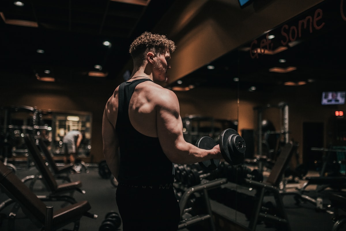 Male athlete with protein-rich nutrition and fitness equipment